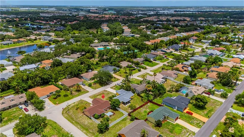 Aerial view of residential area with a large body of water