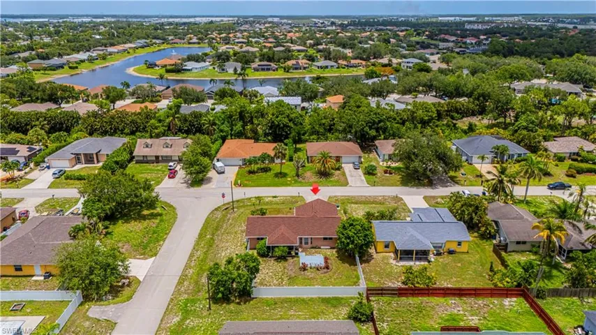 Aerial perspective of suburban area with a large body of water