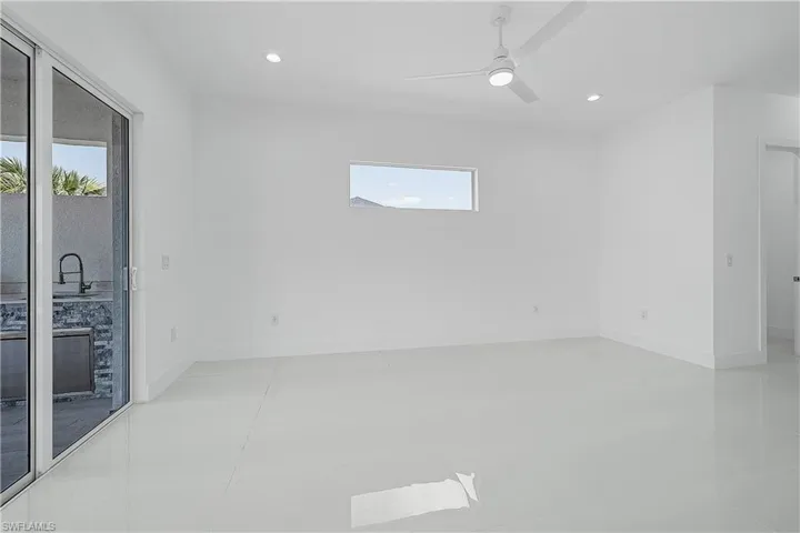 Primary bedroom featuring baseboards, recessed lighting, and a ceiling fan