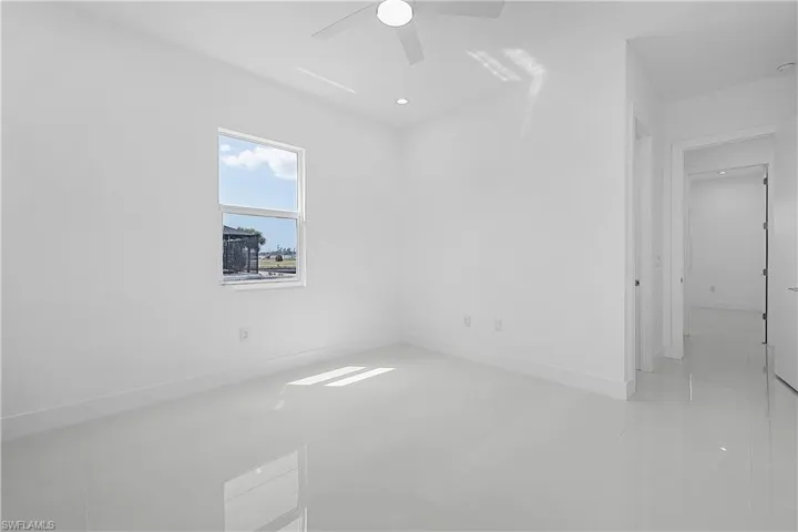 Bedroom featuring baseboards and ceiling fan