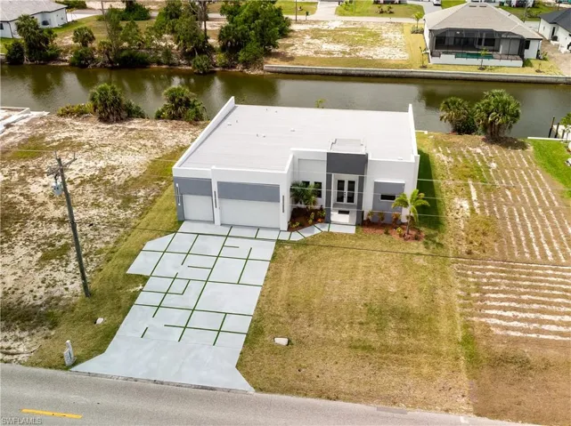 Aerial view of property featuring a water view