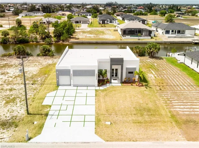 Bird's eye view with a residential and water view