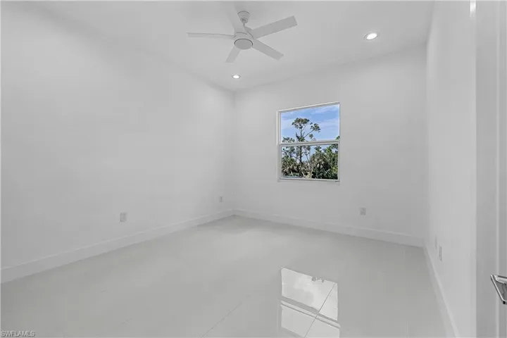 Bedroom featuring baseboards, recessed lighting, and a ceiling fan