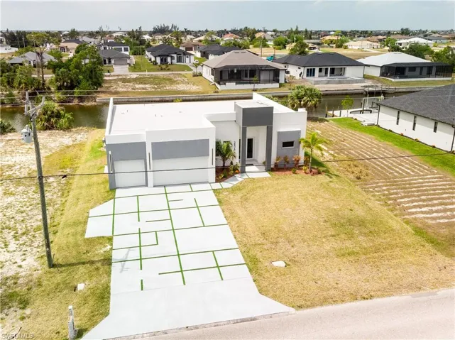 Bird's eye view with a residential and water view
