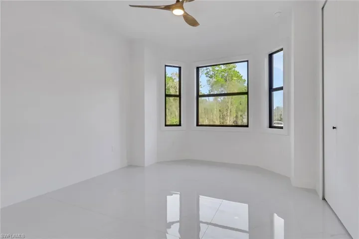 Unfurnished room with a ceiling fan