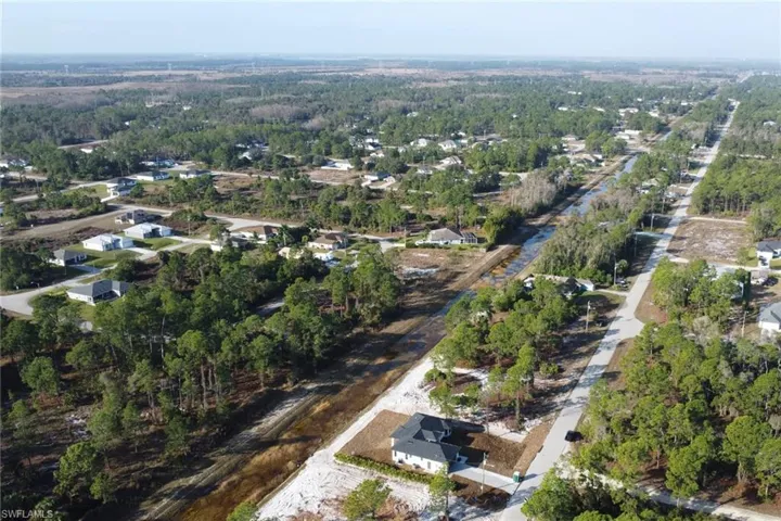 Aerial overview of property's location featuring nearby suburban area