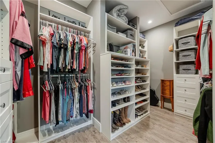 Spacious closet with light wood-type flooring