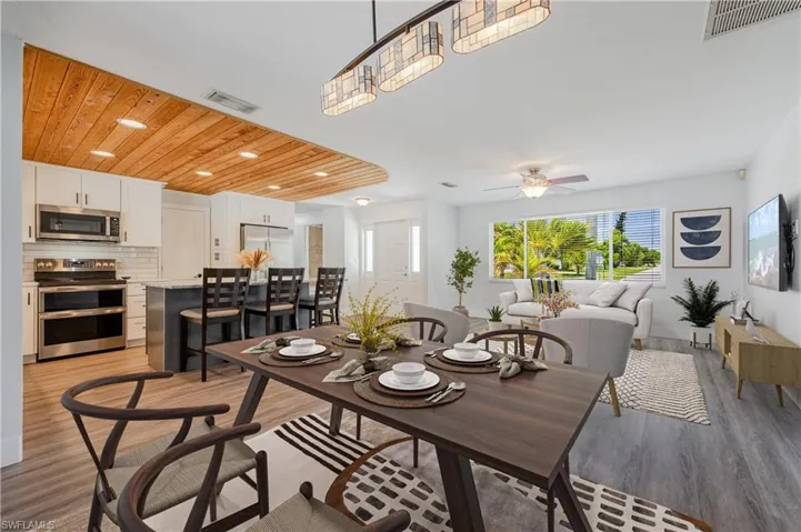 Dining room featuring wooden ceiling, ceiling fan, and light hardwood / wood-style flooring
