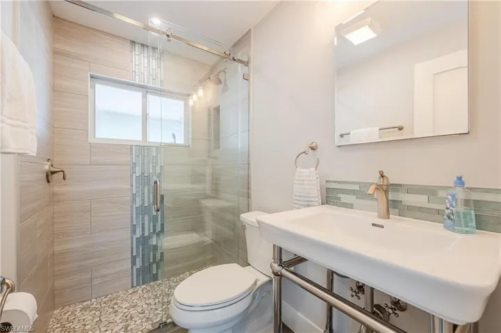 Bathroom with walk in shower and toilet