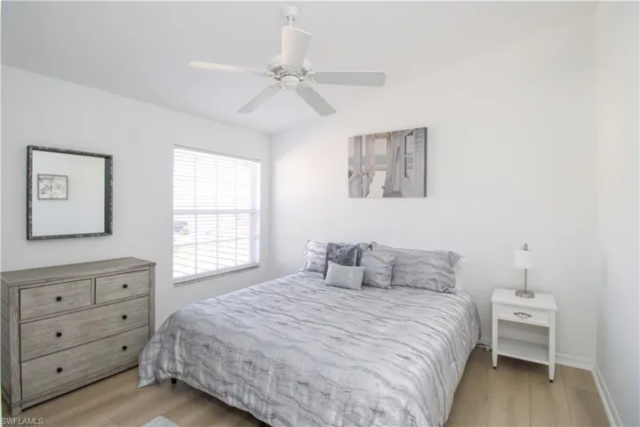Bedroom featuring ceiling fan and light wood-type flooring