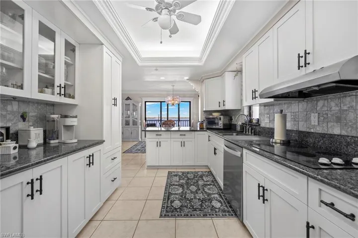 Kitchen is open to the dining room with a peninsula countertop.