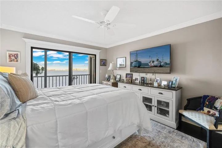 Primary bedroom with new wood flooring and private balcony