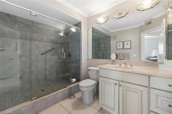 Large guest bathroom with glass shower enclosure
