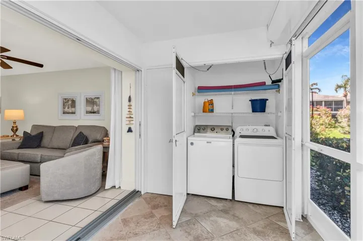 Laundry with storage closet with full size appliances.