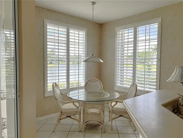 Dining area featuring light tile patterned flooring