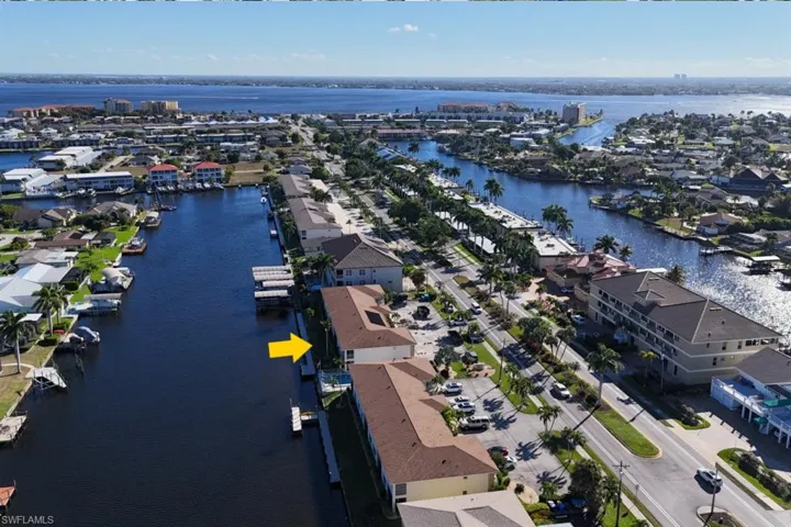 Aerial perspective of suburban area with a nearby body of water