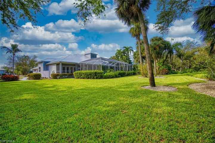 View of yard with a lanai