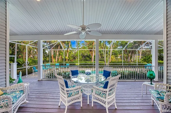 Sunroom / solarium featuring ceiling fan