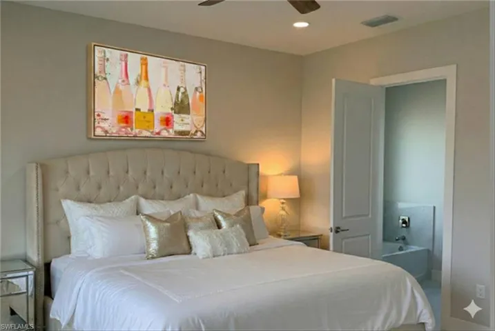 Bedroom with ceiling fan and recessed lighting