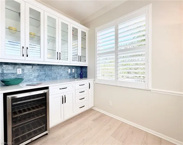 Bar with Built in Wine Frig, Glass Front Cabinets, Tile Backsplash