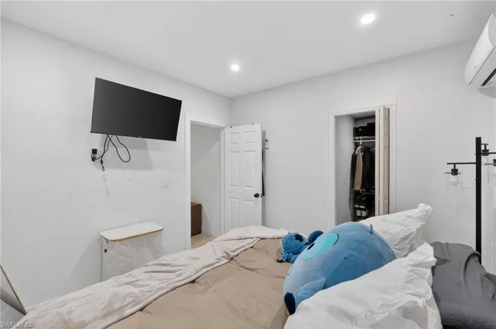 White walls and ceiling with recessed lighting