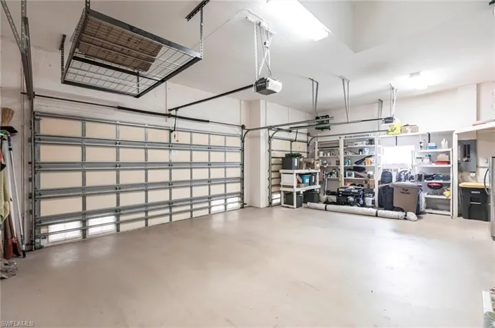 Garage featuring a garage door opener