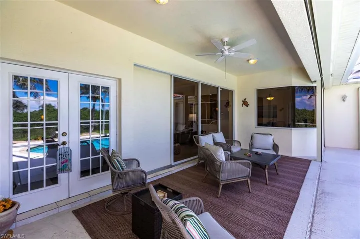 Deck with french doors, an outdoor hangout area, and ceiling fan