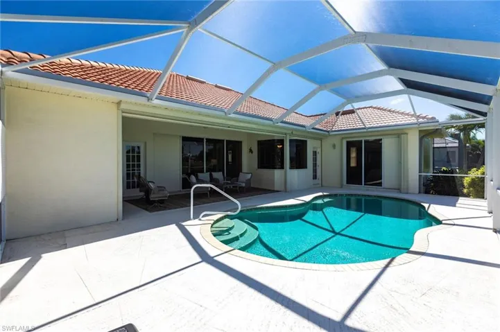 Swimming pool with a patio and a lanai