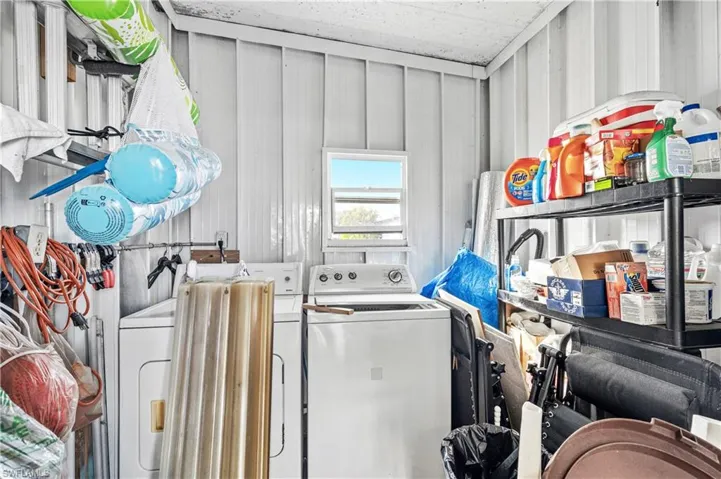 Laundry room with washing machine and dryer
