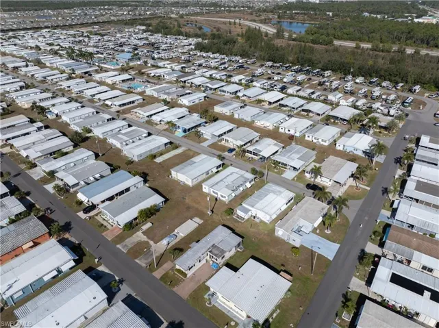Aerial view of property's location featuring nearby suburban area