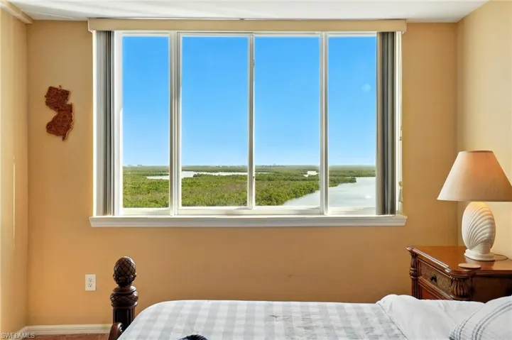 Bedroom with windows and a water view - Virtually Edited Image