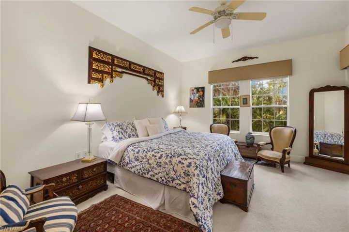 Primary suite is full of light w it's own pair of sliders to lanai