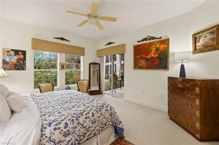 Primary bedroom, double windows & double sliders to Screened Lanai