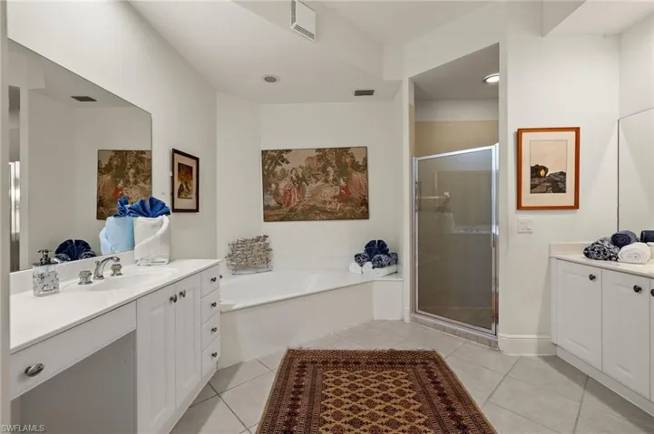 Primary bath has both garden tub and shower