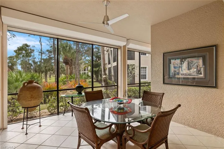 Lanai  from LR has spacious dining area with view of mature tropical landscape & golf view