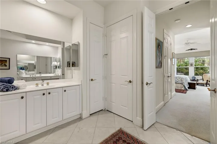 2nd vanity by enclosed toilet, cabinet space and linen closet