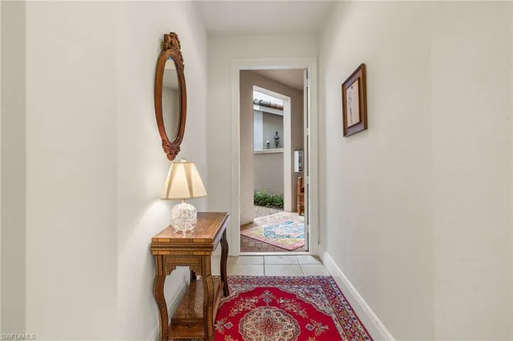 Formal entry foyer leads to LR, Den, Family Room & Screened Lanai