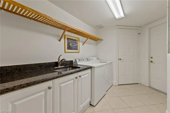 Deep sink, cabinets and shelving w washer & dryer