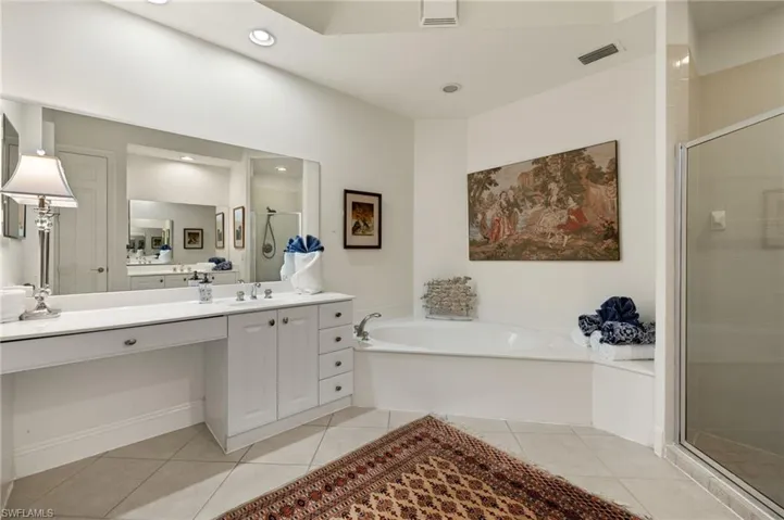 Two vanities, longer one has makeup area