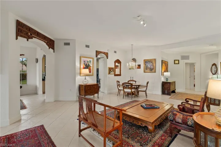 Graceful archway to family room and to kitchen