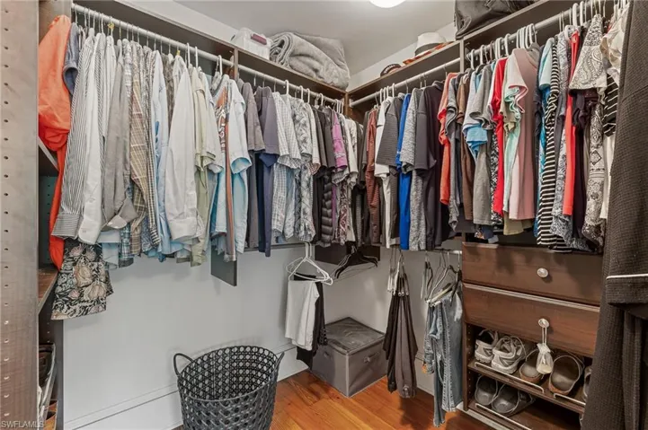 Spacious closet featuring wood finished floors