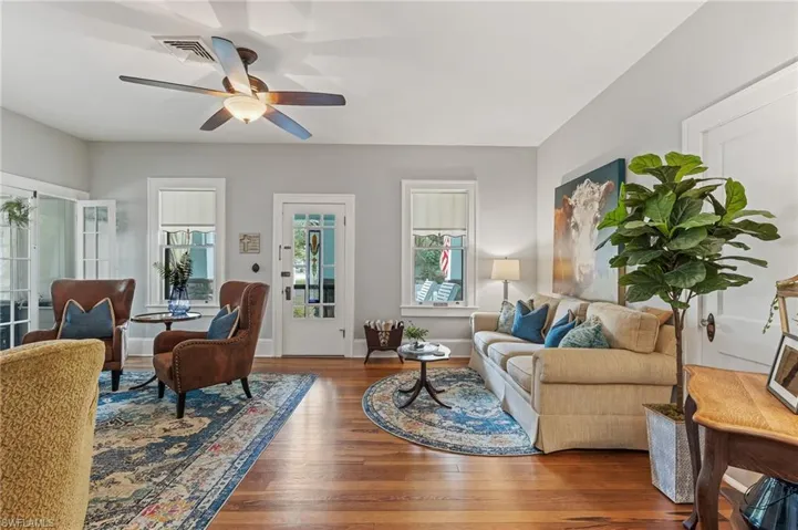 Living room featuring wood finished floors and a ceiling fan