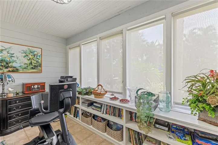 Home office featuring light tile patterned flooring