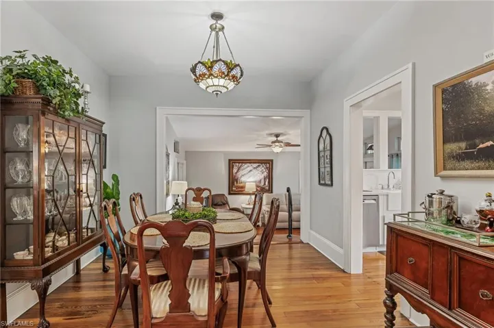 Dining room with light wood-style floors and ceiling fan