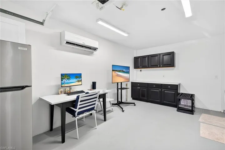 New washer/dryer, and AC unit in the garage/office area