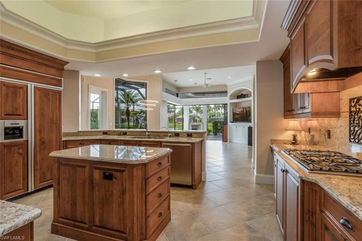 Gourmet Kitchen, 5 top Gas Burner, Center Island w/ Wine Cooler, Wood Cabinetry & Refrigerator
