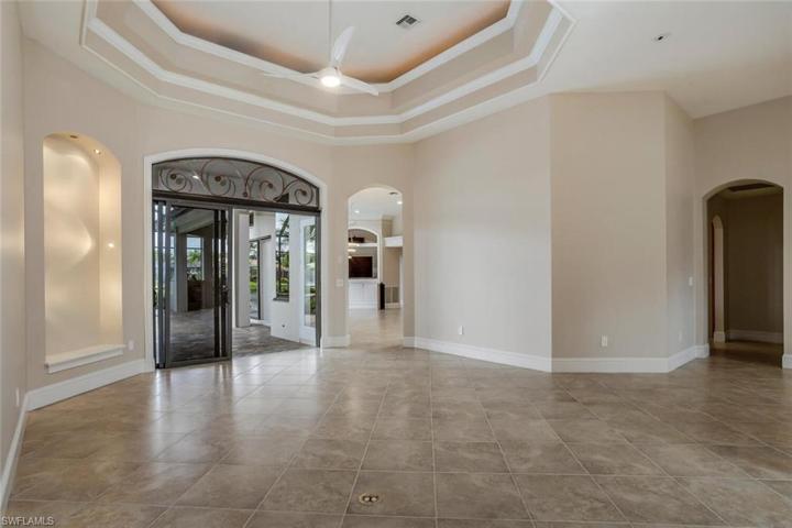 Formal Living, Sliding Glass Doors to Lanai w/ Transom Window, Coffered Ceiling, Lighted Niche