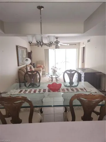 Dining area with a chandelier