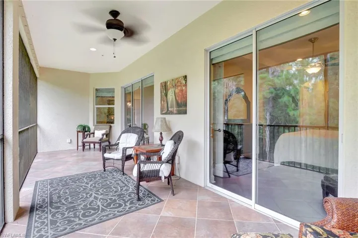 Sunroom featuring ceiling fan