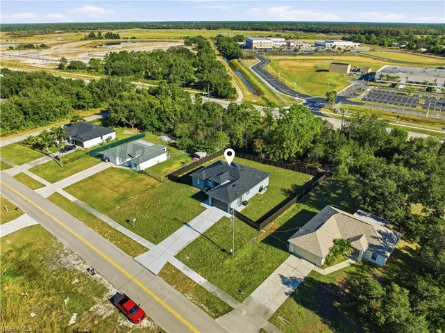 Aerial overview of property's location with nearby suburban area
